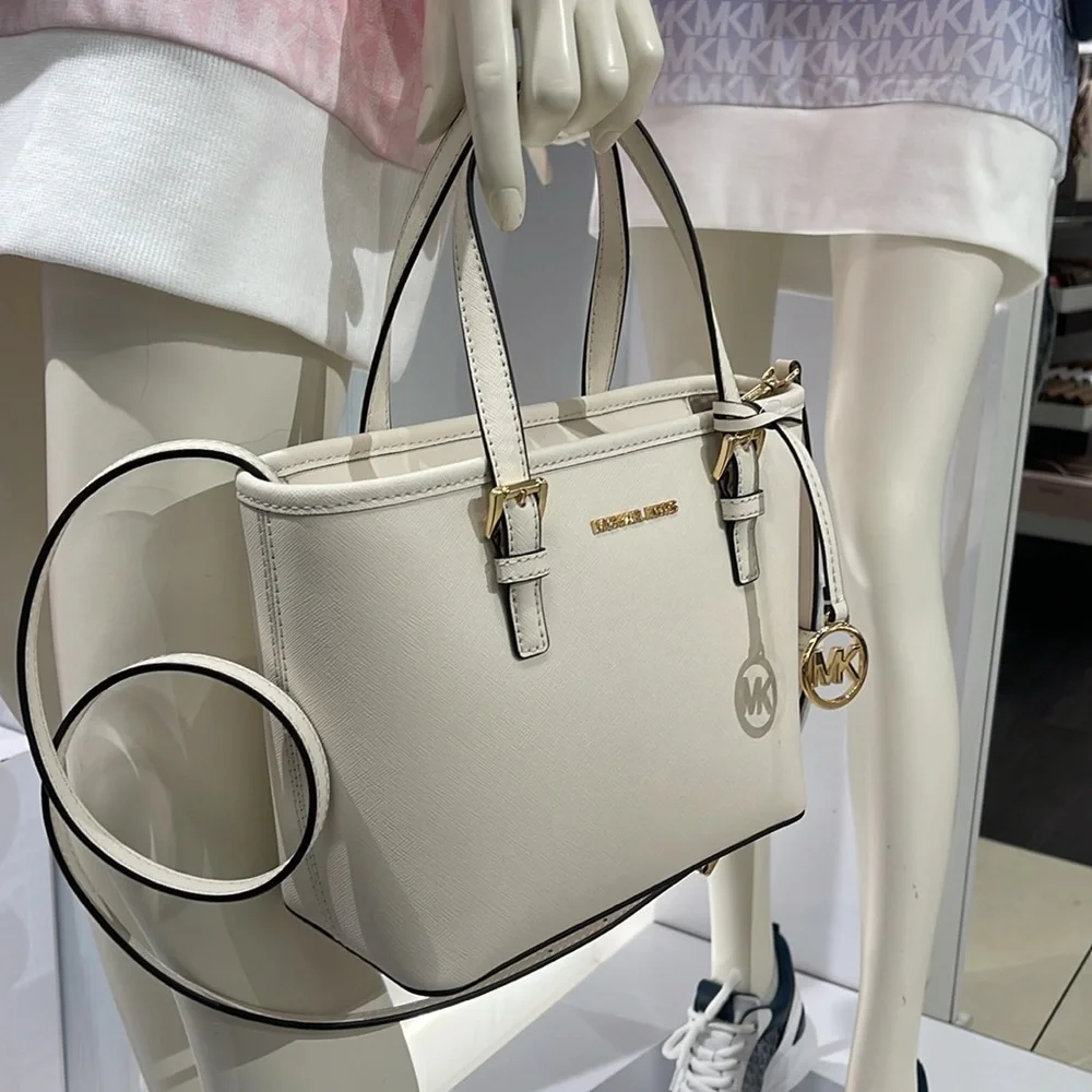 Michael Kors Jet Set Travel Extra-Small Top-Zip Tote Carryall Bag
Light Cream - Picture 13 of 16